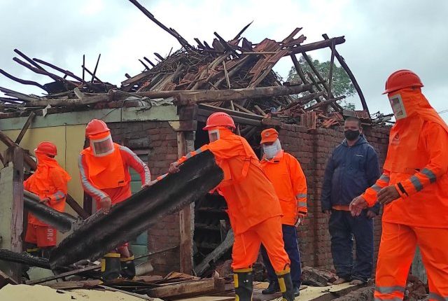 NDRF personnel carry out restoration works in Jalalpur of Gujarat.