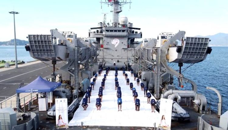 Naval personnel onboard INS Airavat of ENC celebrating 7th International Day Of Yoga at Vietnam