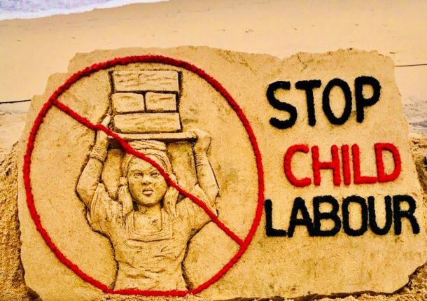 Sudarsan Pattnaik ceates awareness on World Day Against Child Labour with the message 'STOP Child Labour'.