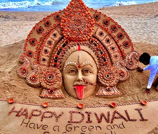 Sand artist Sudarsan Pattnaik creates sand art of Maa Kali with installation of 2,256 diyas ahead of Diwali at Puri beach.