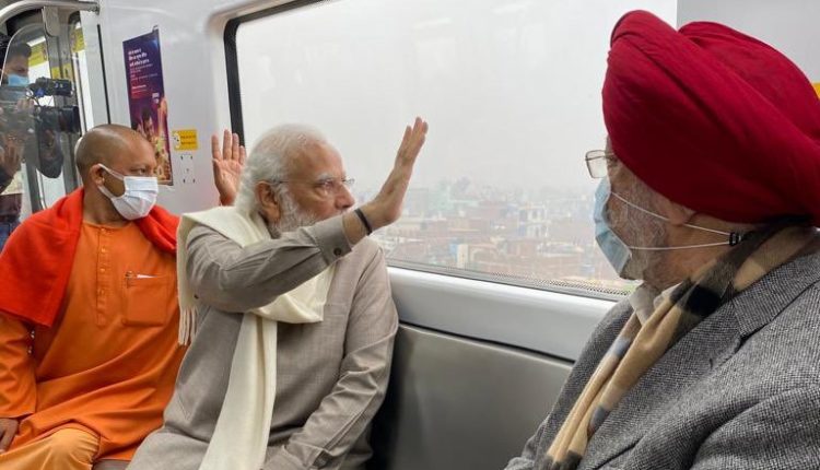 PM Modi inaugurates the completed section of the Kanpur Metro Rail Project and takes a ride in the metro.