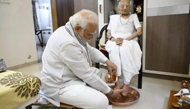 Narendra Modi meets his mother Heeraben Modi at her residence in Gandhinagar on her 100th birthday today.