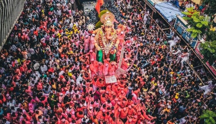 People gather to celebrate the immersion of Lord Ganesha's idol in Mumbai on the occasion of Ganesh Visarjan.