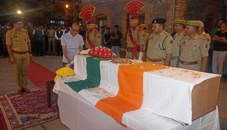 Father Ghulam Hassan Bhatt (Retd DIG) paid a floral tribute to martyr son Deputy SP Humayun Bhat who lost his life in the Anantnag encounter.