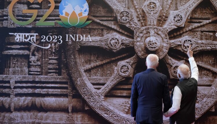 Welcome handshake of all leaders begins showcasing Odisha's Konark Wheel. PM Modi explained about Konark wheel to US President Joe Biden.