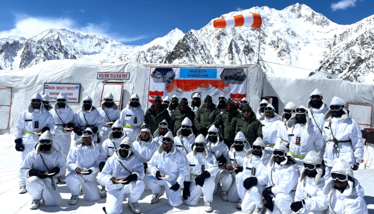 Defence Minister Rajnath Singh interacts with the Armed Forces personnel deployed at Kumar's post of Siachen Glacier in Ladakh.