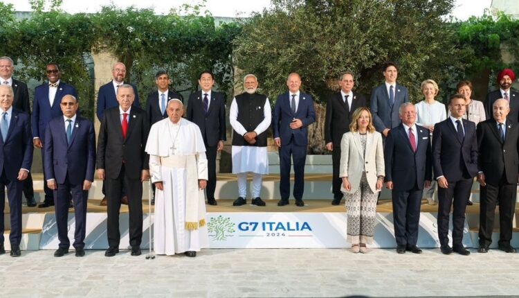 Italy: Leaders from around the World posed for a family photo at the 'Outreach Nation' session of the G7 Summit on Friday night.