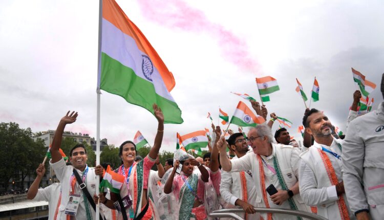 Olympic medalist PV Sindhu and Table Tenis player Sharath Kamal carried India's flag at the Paris Olympics opening ceremony.