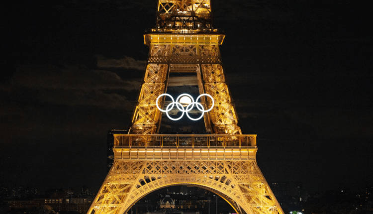 Sparkling Eiffel Tower lights up ahead of opening ceremony of Olympics.