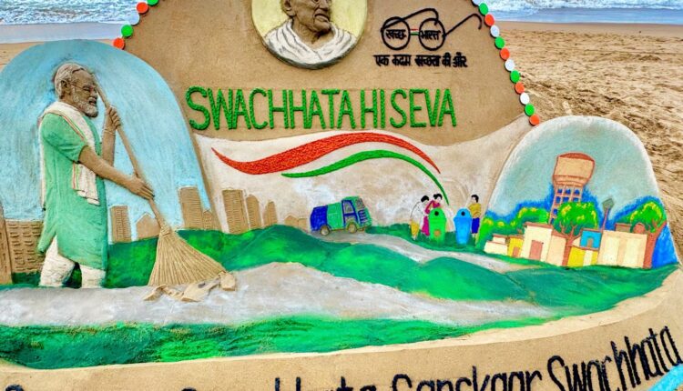 Renowned sand artist Sudarsan Pattnaik creates sand art on the occasion of Swachchata Hi Sewa campaign on Mahatma Gandhi's birth anniversary.