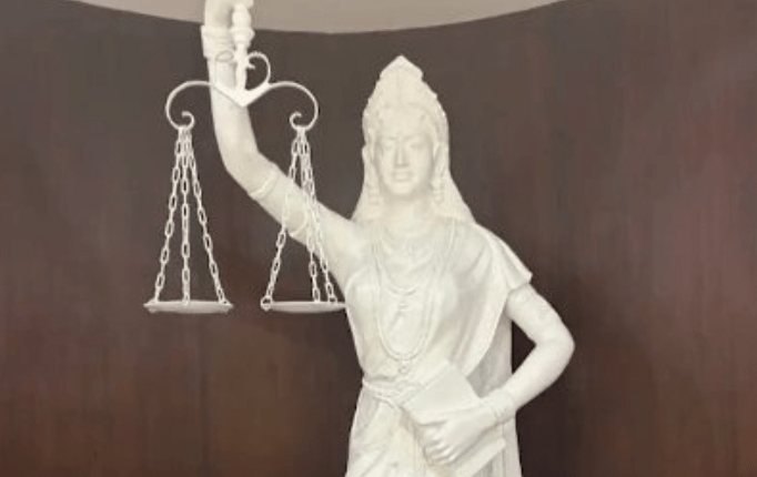 A new statue of the Lady of Justice at the Supreme Court replaced the traditional blindfold and sword with open eyes and the Indian Constitution.