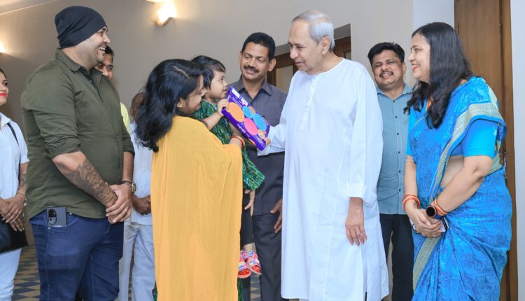 Naveen Patnaik blessing a Kid on Children's Day