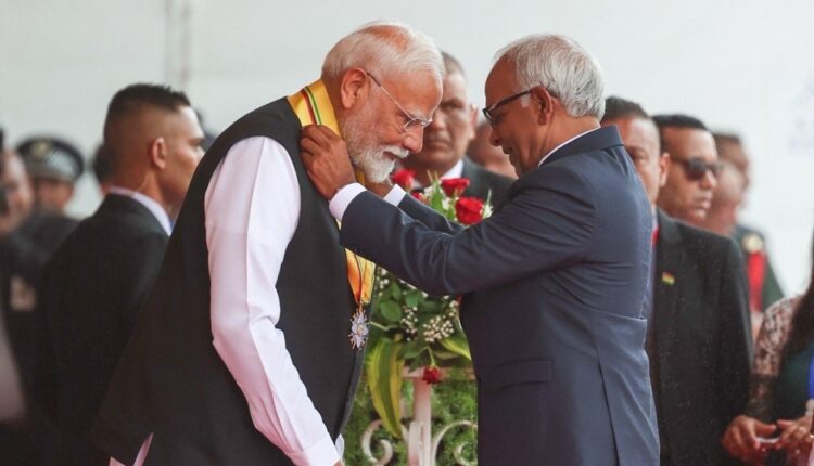 Prime Minister Narendra Modi conferred with Mauritius's highest civilian award, by President of Mauritius Dharam Gokhool at the National Day Celebrations.