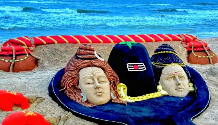 Sand artist Sudarsan Pattnaik creates 30-feet sand sculpture of Lord Shiva, Goddess Parvati and Kanwar on the fourth and last Monday of Shravan month.