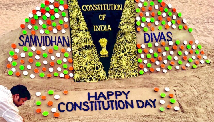Renowned sand artist from Odisha Sudarsan Pattnaik creates sand art on the occasion of Constitution Day.