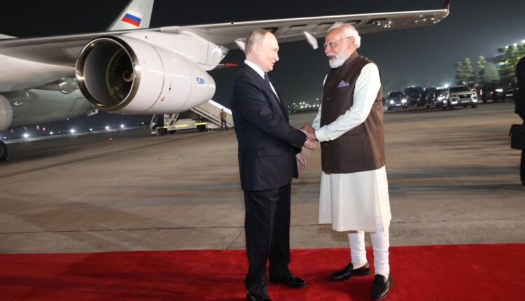 Prime Minister Narendra Modi receives Russian President Vladimir Putin at Palam Technical Airport in Delhi.  PM Modi and Putin travel in the same car.
